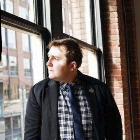 Profile Picture of Scot Nelson, looking out a window.